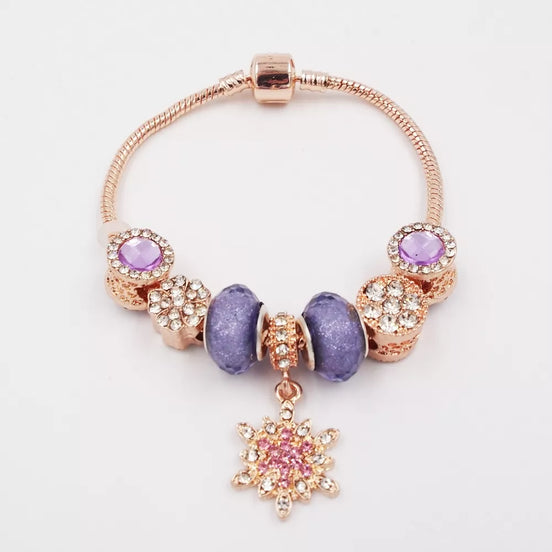 Rožinio aukso spalvos apyrankė su violetiniais akcentais