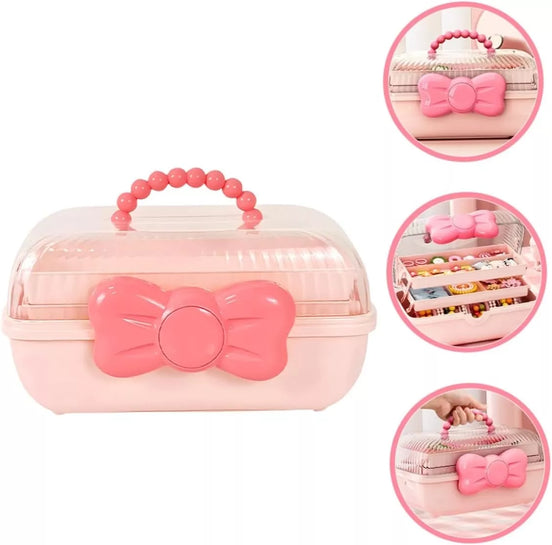 Rožinė papuošalų dėžutė su kaspinu ir rankena