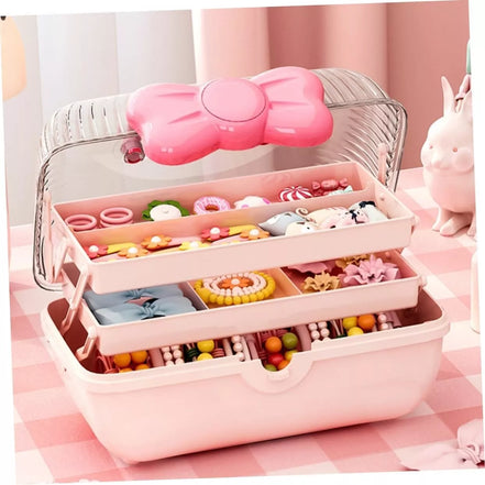 Rožinė papuošalų dėžutė su kaspinu ir rankena