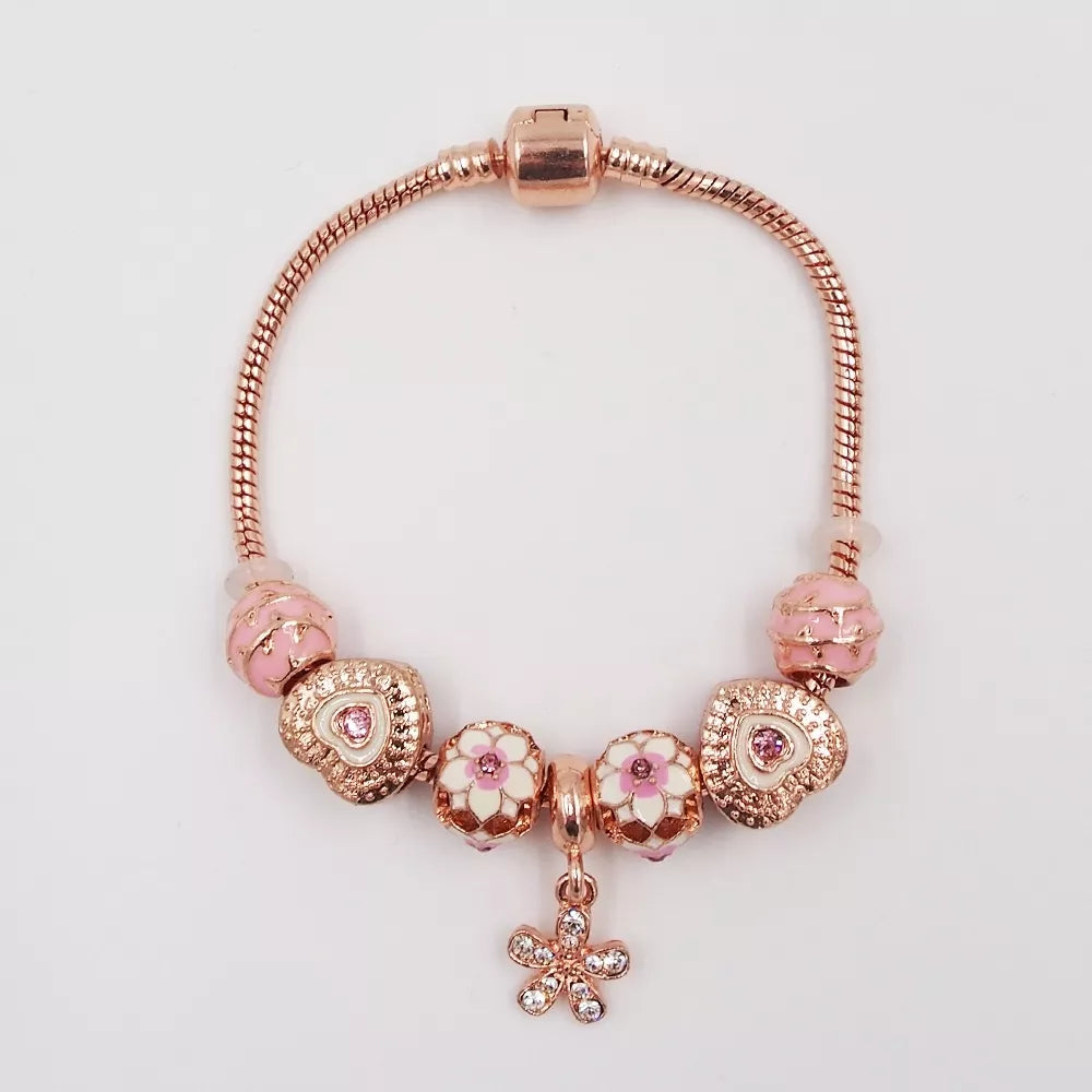 Rožinio aukso spalvos apyrankė su rožiniais karoliukais